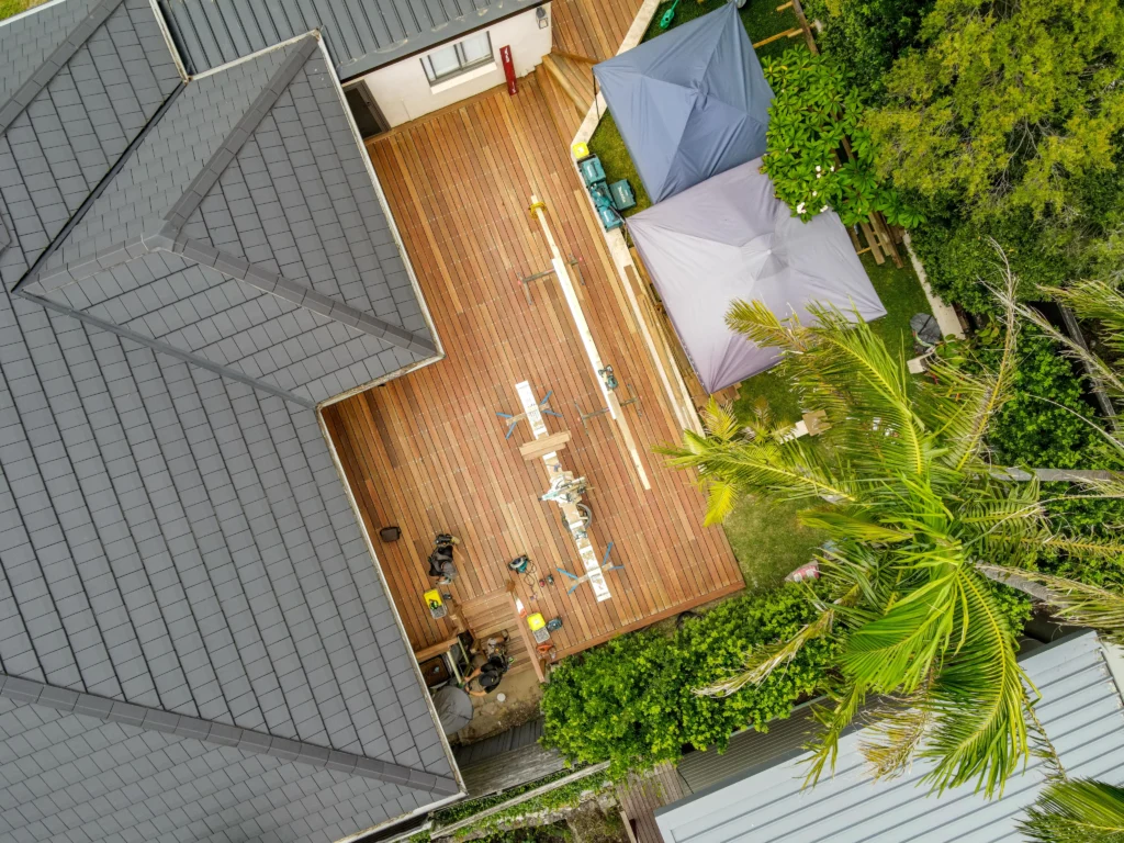 NF Build aerial view of outdoor timber deck construction site and house roof
