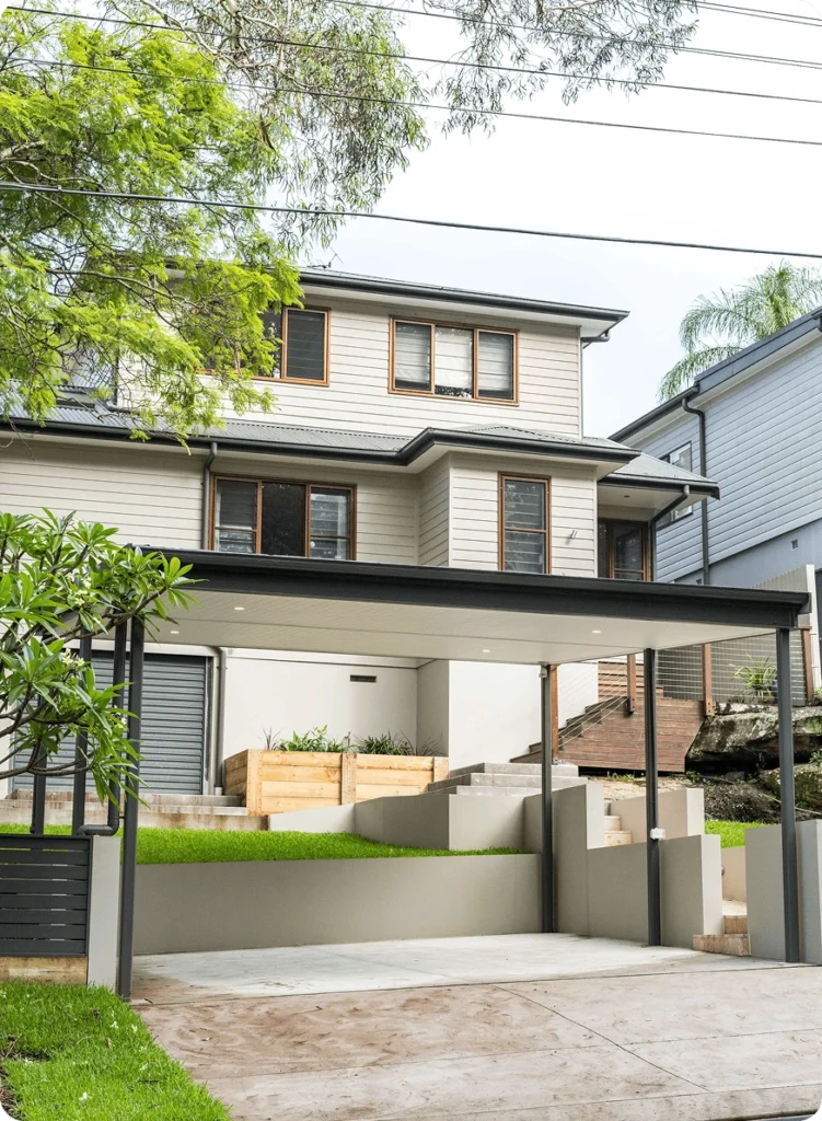 NF Build double storey home extension featuring modern carport structure and landscaped front yard