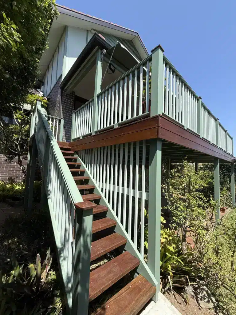 NF Build elevated outdoor timber deck with stairs and sage green railings