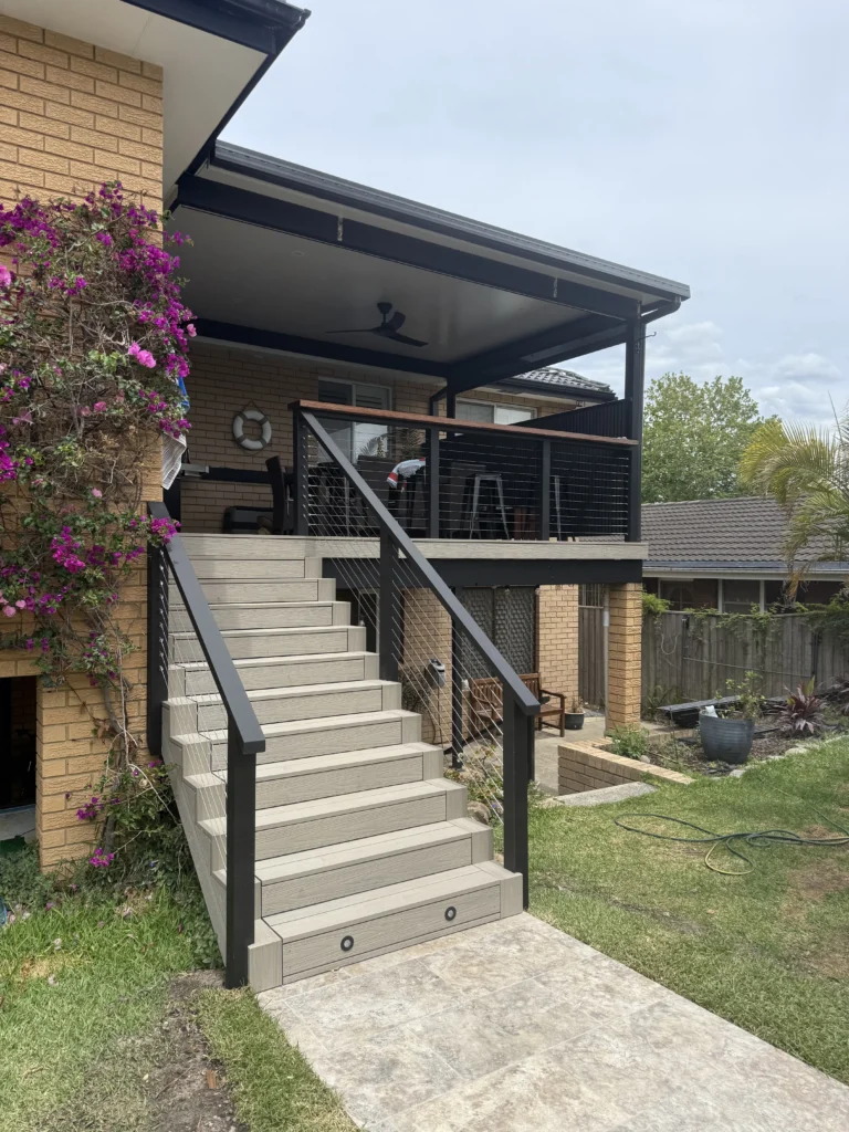 NF Build elevated outdoor patio extension with covered deck and exterior staircase