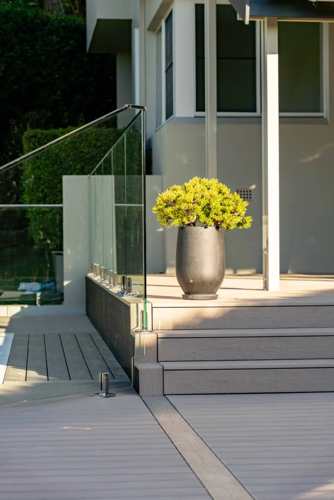 NF Build modern outdoor composite deck with stairs and frameless glass pool balustrade